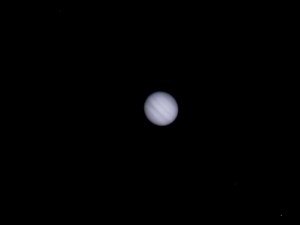 Jupiter, 11th Feb 2012, early evening, moving lower in the west. Taken from approx 4 mins of webcam video. Ganymede, IO, Europa moons just visible bottom right to top left.